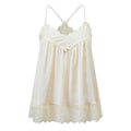 An ivory white lace and satin slip dress with thin adjustable shoulder straps, a scalloped lace neckline, and a matching lace hem, shown against a plain white background, Obroi