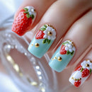 Nails with strawberry and flower design on a light blue background, Obroi