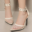 White high-heeled shoes with lace detailing on a neutral background, Obroi
