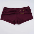 Maroon shorts with a gold ring on a white background, Obroi
