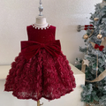 Red floral dress on a mannequin with a Christmas tree in the background, Obroi