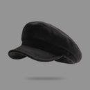 Black flat cap on a gray background, Obroi
