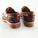 Pair of brown leather shoes with gold accents on a white background, Obroi