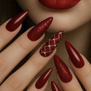 Close-up of a hand with red glittery nails and a matching lip color, Obroi