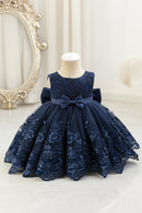 Navy blue lace dress with a large bow on a mannequin against a white background, Obroi