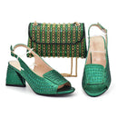 Green high-heeled shoes with a matching handbag on a white background, Obroi