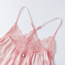 A light pink satin camisole nightgown with matching lace cups and thin adjustable shoulder straps, laid flat on a white background, Obroi