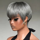 Woman with styled gray hair wearing a black halter top against a neutral background, Obroi
