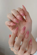 Close-up of hands with pink nail polish on a neutral background, Obroi