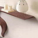 Small white lamp with black accents on a wooden shelf against a beige wall, Obroi