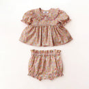 Floral baby top and bloomers set on a white background, Obroi