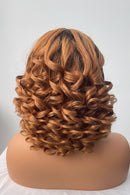 Curly brown hair styled on a mannequin head against a white background, Obroi