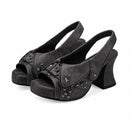 Black suede high-heeled shoes with star embellishments on a white background, Obroi