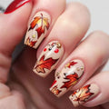 Nails with autumn leaf design and red polish on a neutral background, Obroi