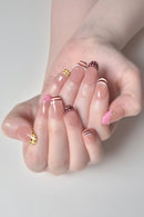 Hand with stylish nail art on a light gray background, Obroi