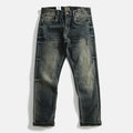 Pair of distressed blue jeans on a white background, Obroi