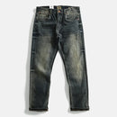Pair of distressed blue jeans on a white background, Obroi