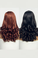 Two mannequin heads with styled hair, one red and one black, on a white background, Obroi