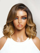 Mannequin head with a brown and blonde ombre wig on a white background, Obroi