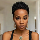 Woman with styled hair wearing earrings and a necklace against a neutral background, Obroi