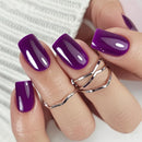 Hand with purple nails and silver rings on a white background, Obroi