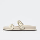 White sandal with a strap on a light gray background, Obroi