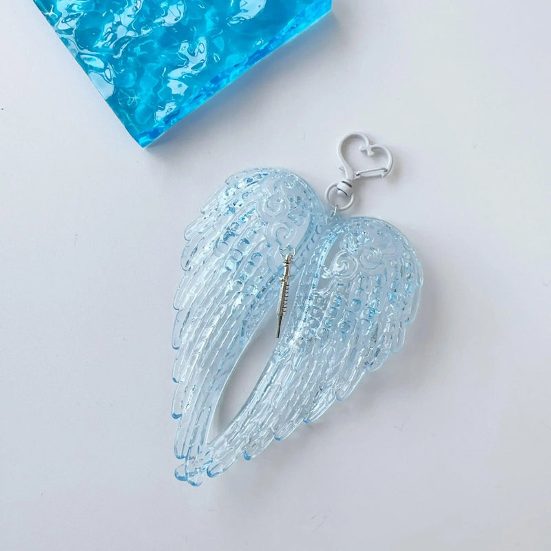 Obroi Blue angel wing pendant on a white background