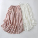 Two flowing skirts, one pink and one white, on a light gray background, Obroi