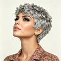 Woman with styled silver hair against a plain background, Obroi