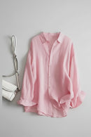 Pink shirt on a white background with a handbag to the left, Obroi