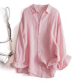 Pink shirt on a white background with a handbag to the left, Obroi