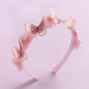 Pink headband with butterfly decorations on a light pink background, Obroi