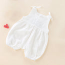 White baby romper on a beige background, Obroi