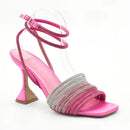 Pink high-heeled sandal with a decorative strap on a white background, Obroi