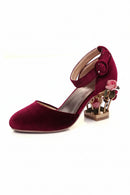 Maroon high-heeled shoe with floral design on a white background, Obroi