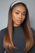 Woman with long straight hair wearing a headband against a gray background, Obroi