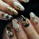 Nails with gold and black decorative designs on a dark background, Obroi