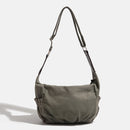 Green shoulder bag on a light gray background, Obroi