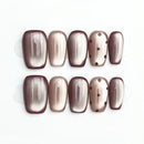 Set of handmade nails with a slight difference on a white background, Obroi