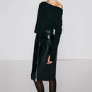 Black off-shoulder dress with leather accents on a plain background ,Obroi