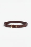 Brown belt with gold buckle on a light beige background, Obroi
