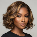 Woman with styled hair against a neutral background, Obroi