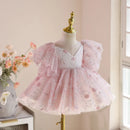 Pink lace dress on a mannequin with a soft pink background, Obroi