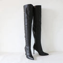 Black knee-high boots with high heels on a white background, branded 'Obroi'.