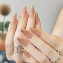 24 handmade almond nails Sheer nude base with metallic gold gradient french tip
