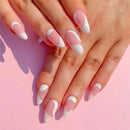 Close-up of hands with pink and white nail polish on a pink background, Obroi
