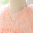 Mannequin wearing a light pink dress with floral details, Obroi