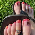 Close-up of toes with colorful nail art on grass background, Obroi