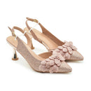 Pair of rose gold high-heeled shoes with floral embellishments on a white background, Obroi