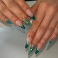 Close-up of hands with teal and gold nail art on a light background, Obroi